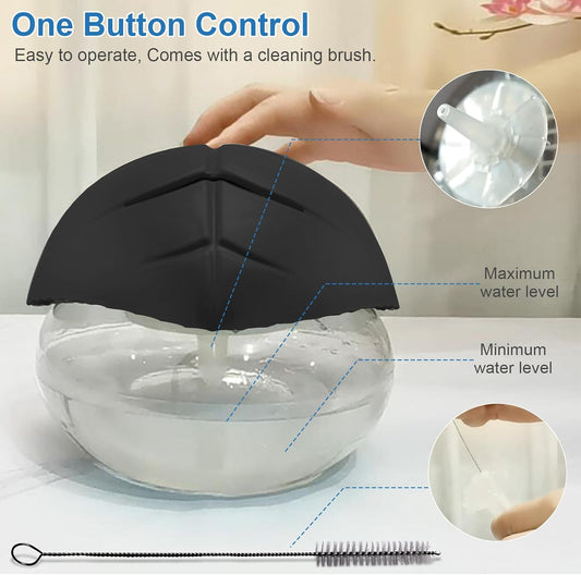 Black air humidifier emitting mist on desk setup