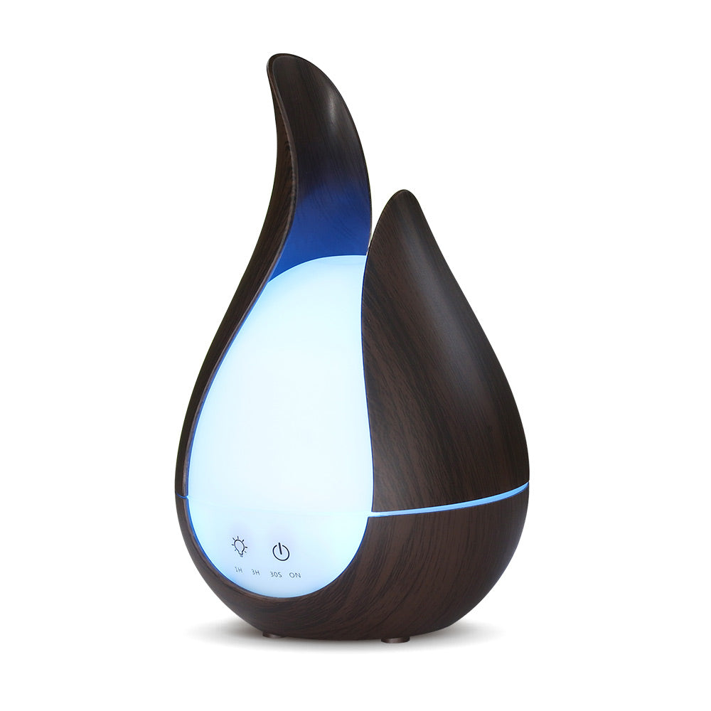 Aroma Humidifier on nightstand, warm evening glow and mist effect