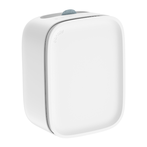 Premium humidifier in white finish on minimalist backdrop emitting fine mist