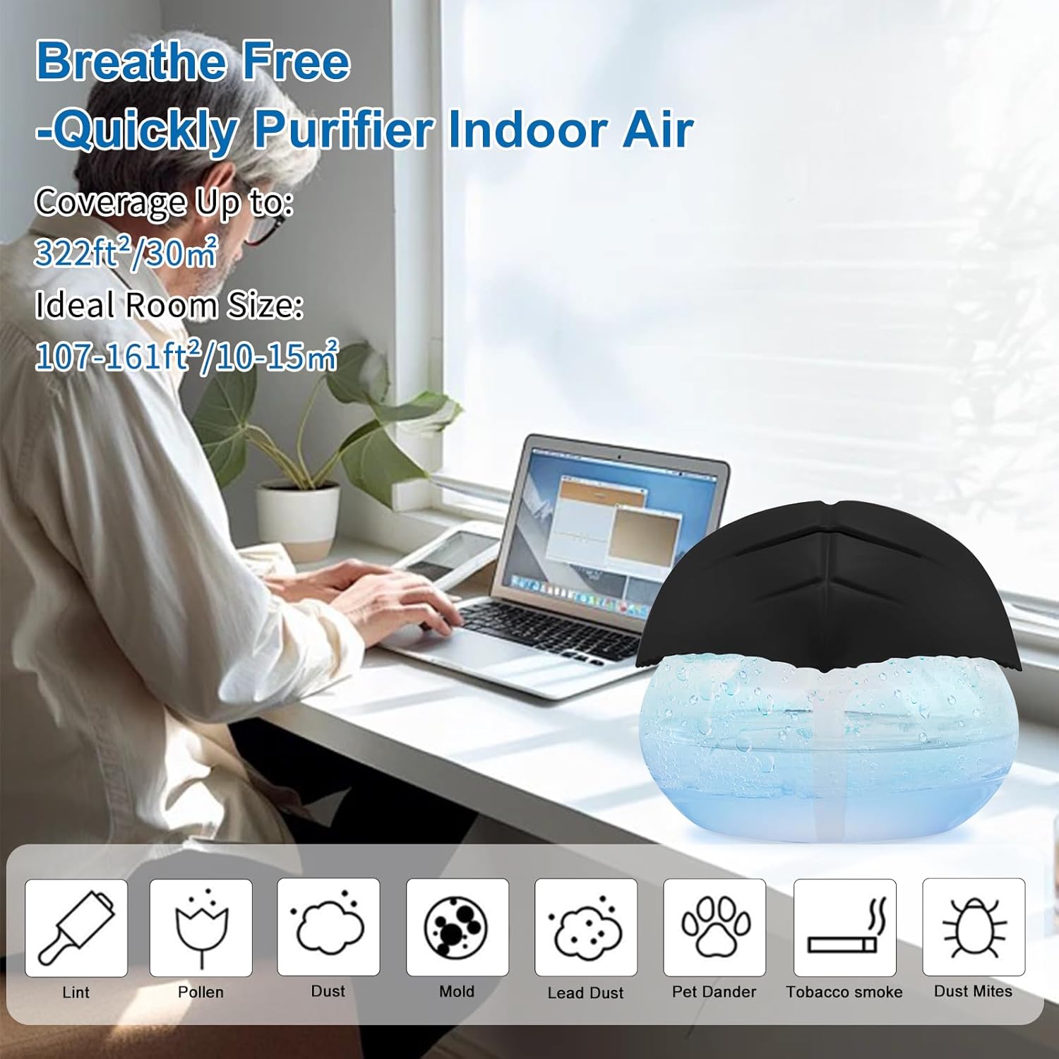 Air humidifier beside laptop for workspace setup
